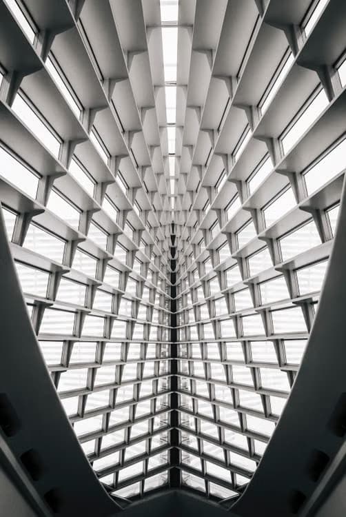 A symmetrical architectural ceiling receding to a vanishing point