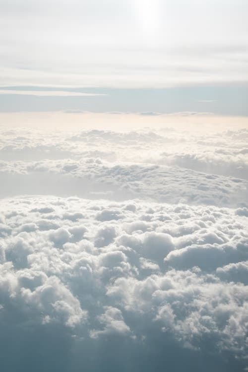 A layer of cloud tops seen from above, lit by low sun